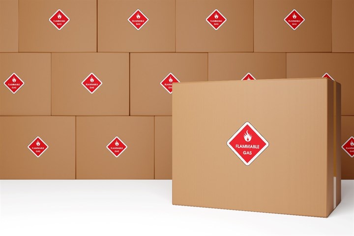 UN certified packaging requirements; UN certified boxes containing a flammable gas are stacked on top of one another